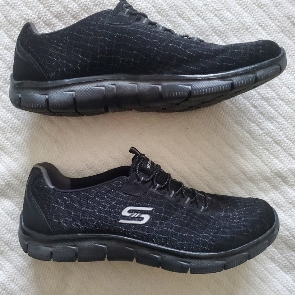 Black/silver Sketchers slip on shoes. Size 11